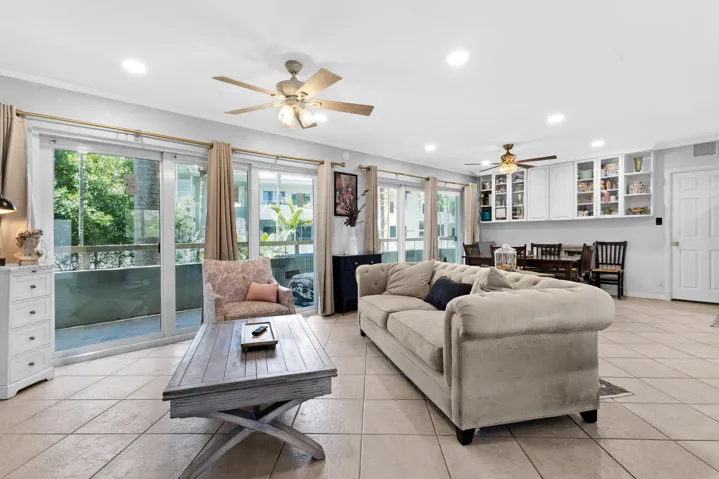 Large living area with impact sliders and garden/pool views