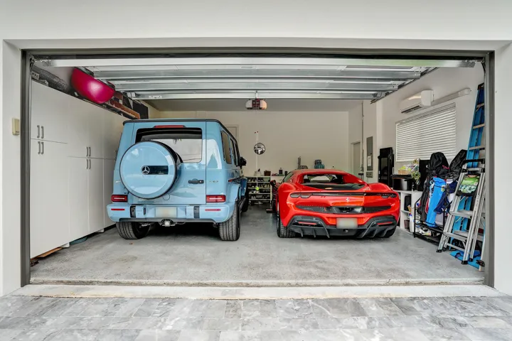 Oversized 2 car garage comfortably holds 2 cars plus storage. Epoxy floor