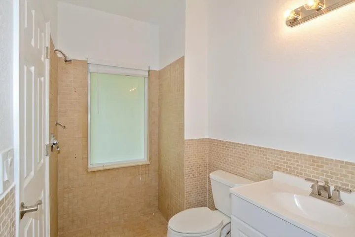 14_4935LamePantherLane_10_3rdBathroom_Fl