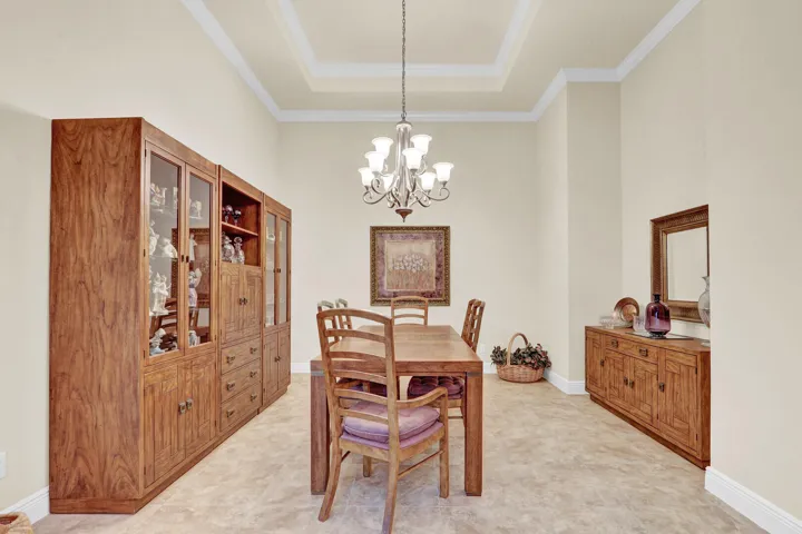 Formal dining boasting volume ceilings and crown molding (throughout)