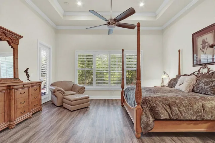 Master bedroom, tray ceiling, large and spacious, with a private door out to the back patio