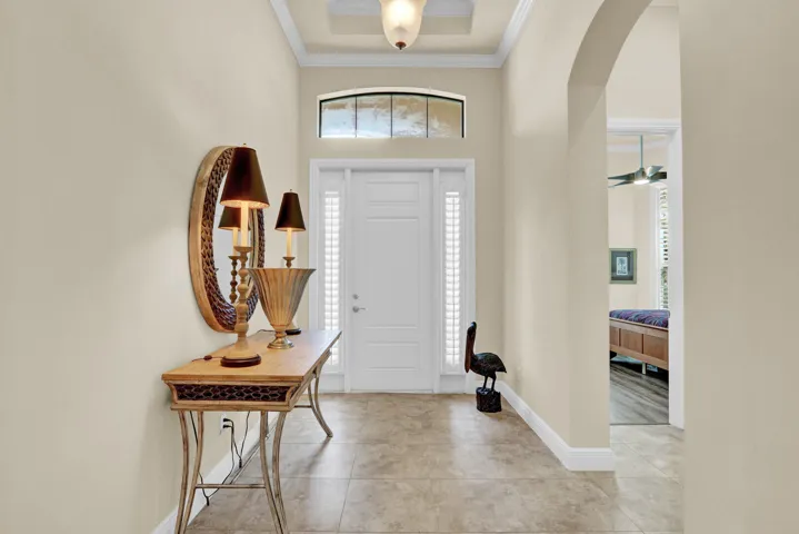 Entry view of front door and bedroom 2, and guest bathroom to the right