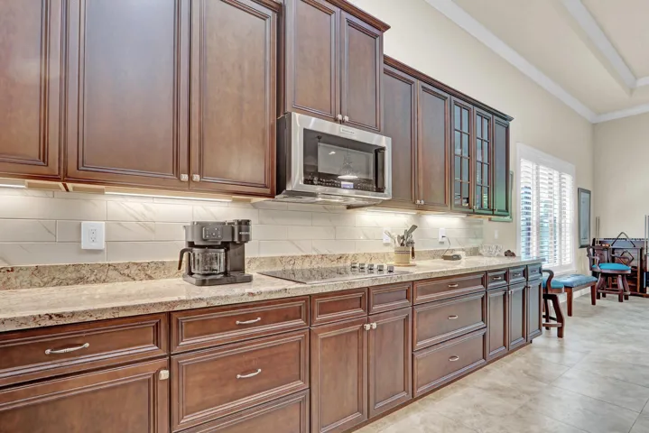Nuetral wall color and large tiled floors give the home a bright and inviting feel
