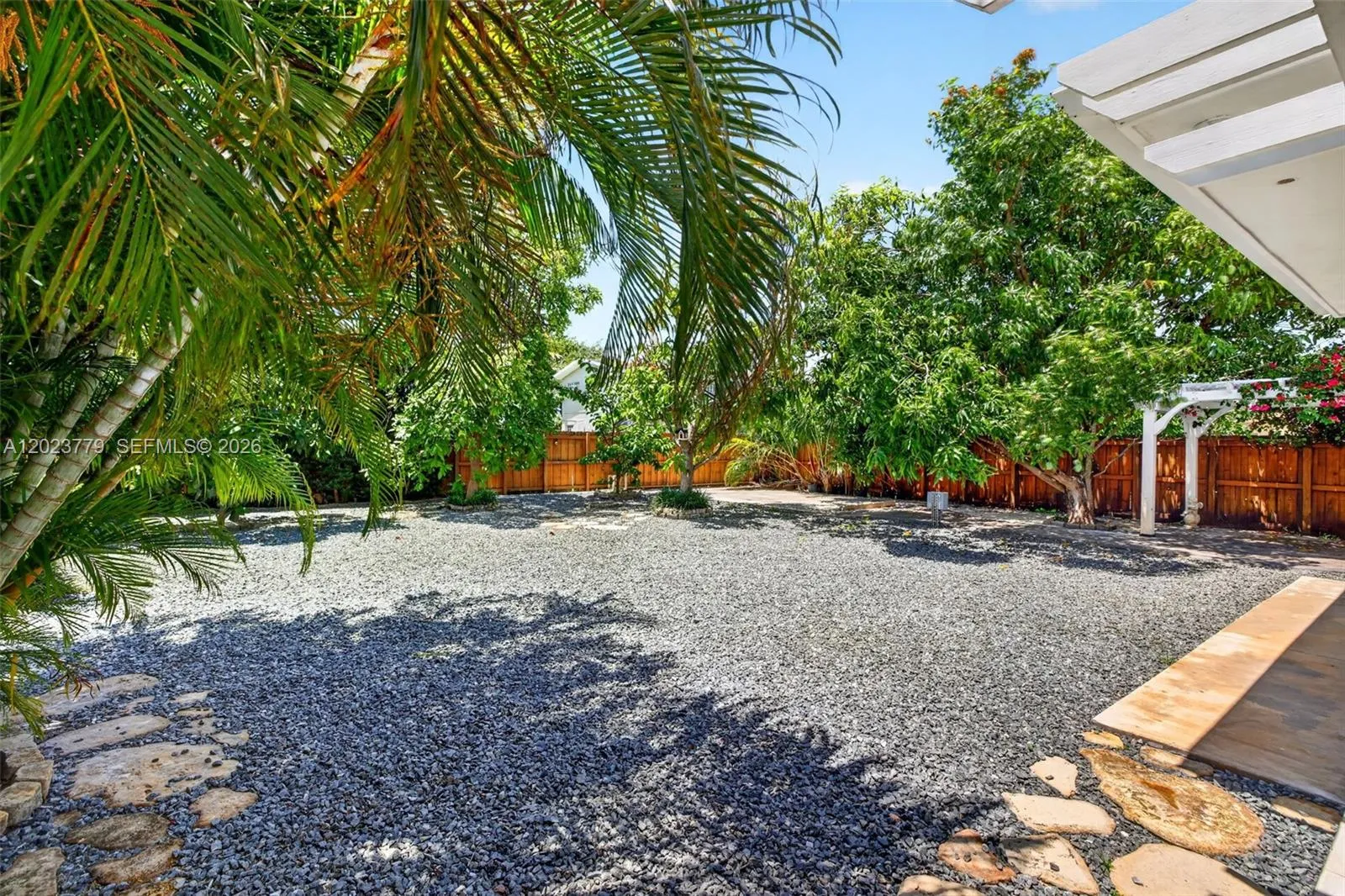 Large inviting backyard w/ stoneLarge inviting backyard w/ stone chips and tons of fruit trees. Electric back gate to allow extra parking for your RV, Boat, Trailer or additional vehicles chips and tons of fruit trees. Electric back gate to allow extra parking for your RV, Boat, Trailer or additional vehicles