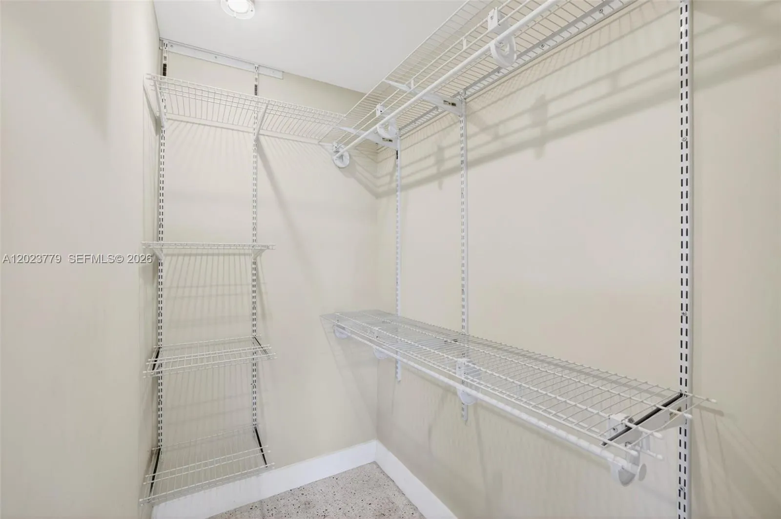 Primary walk in closet w/ upgraded adjustable shelving