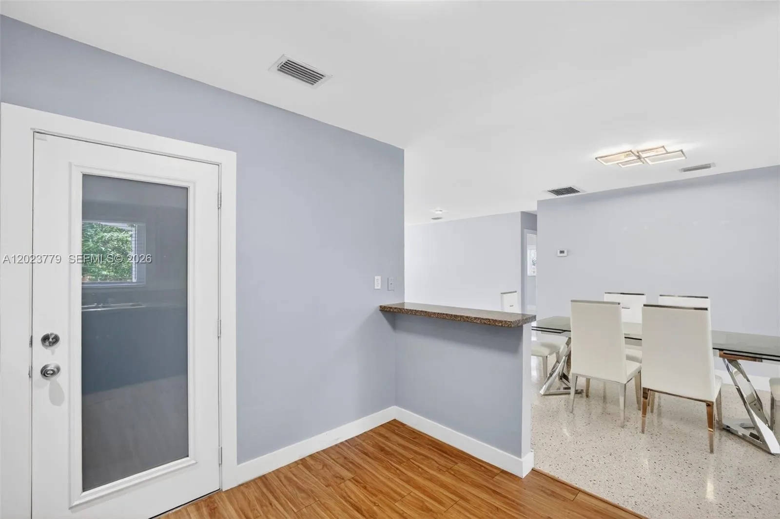 Door within kitchen leads to garage / laundry area