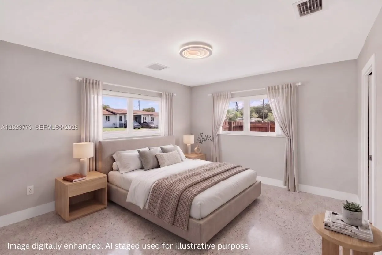 Primary bedroom - nice size w/ two impact windows w/ en suite bathroom and walk in closet. Virtually staged