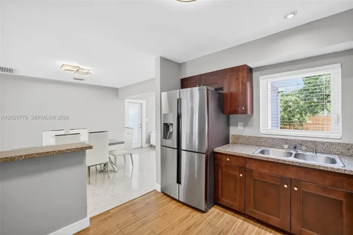 Granite Counters, Wood Cabinets and Stainless Appliances w/ window overlooking to backyard