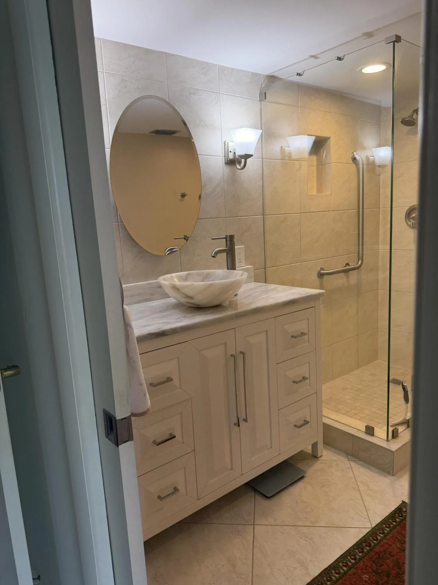 Carrara marble topped vanity and vessel sink