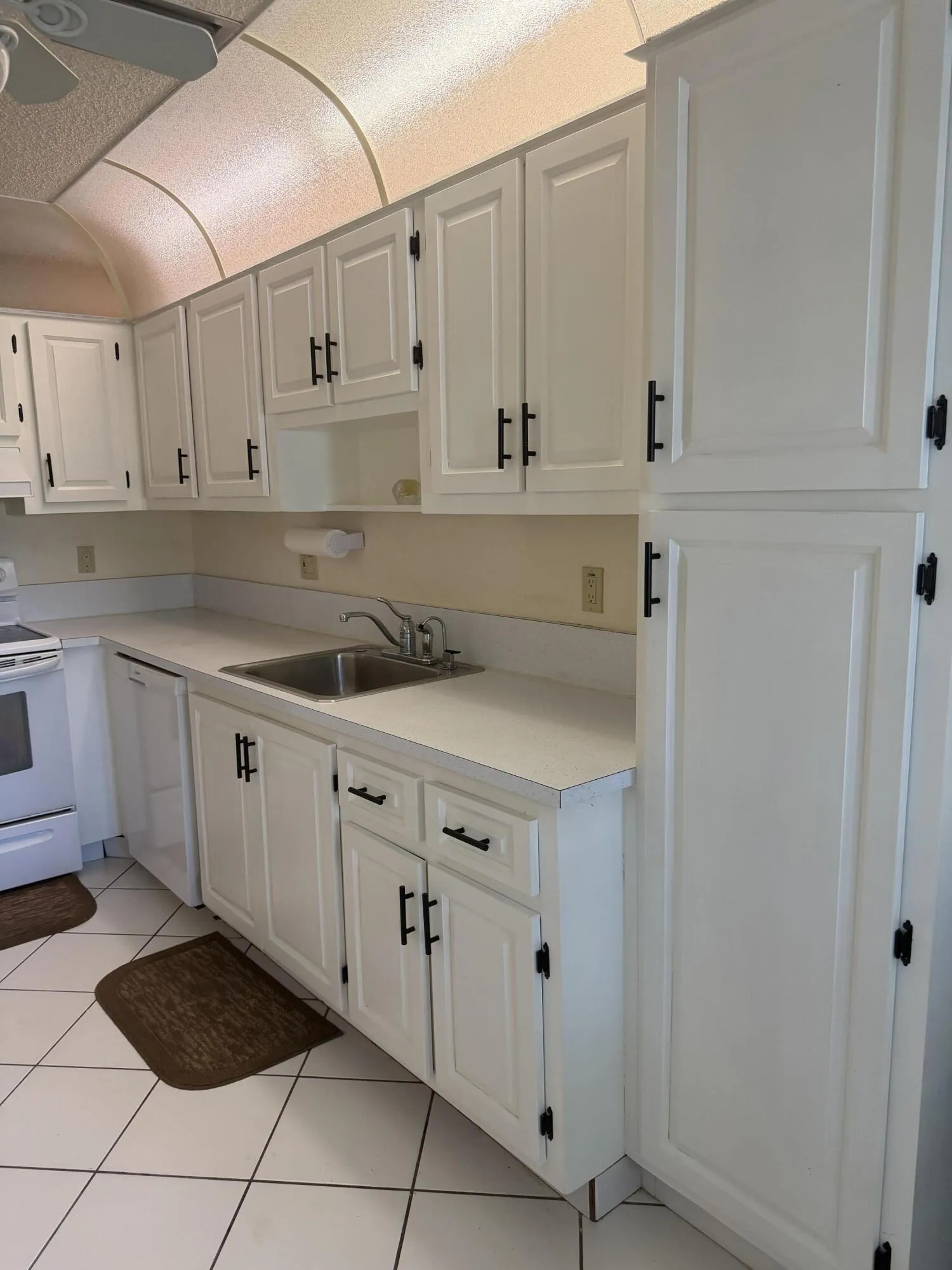 Updated cabinets with black hardware