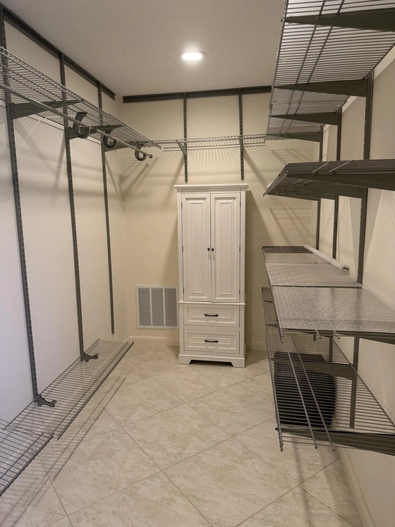Primary walk-in; with new tile and closet storage system