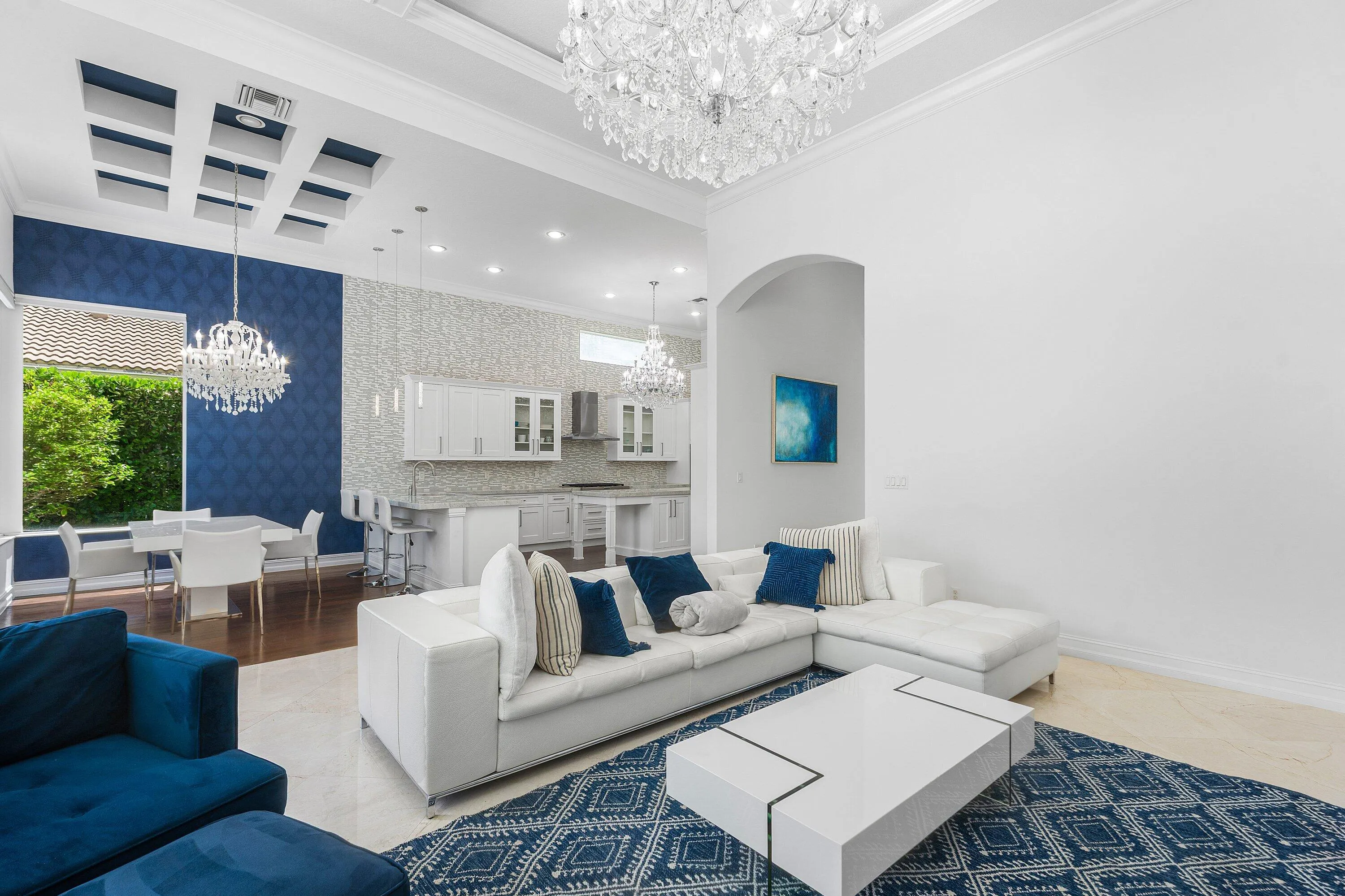 grand area opens to dining nook + kitchen
