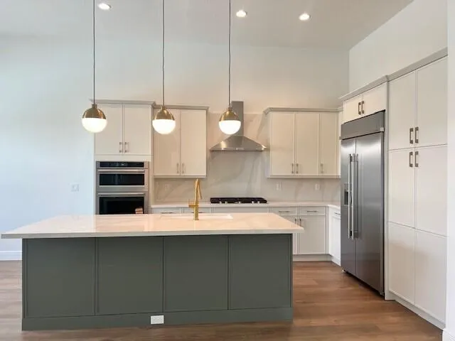 An expanded luxury primary bedroom with a spacious open layout, natural light, room for a king-size bed and elegant sitting area
