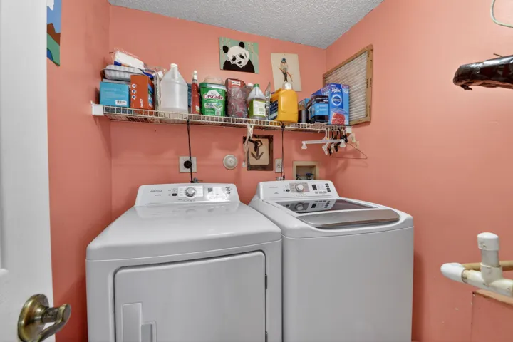 Laundry room inside the home has room to add extra cabinets or shelving for more storage