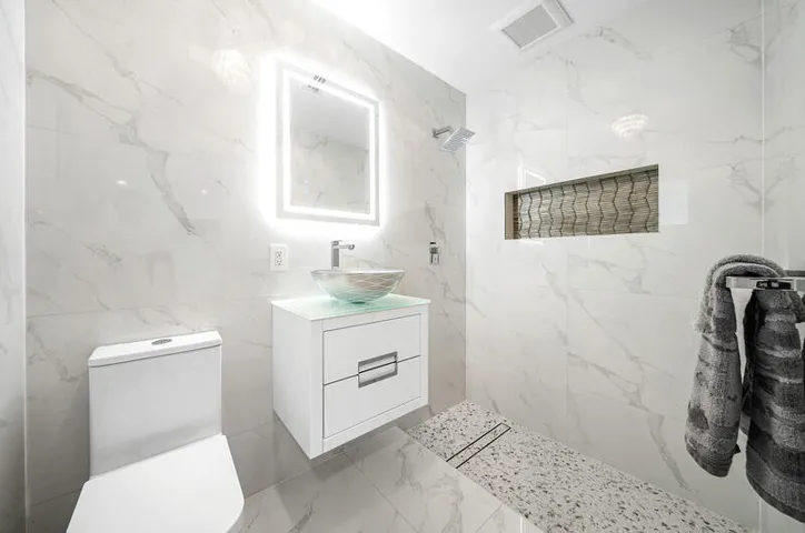 Second primary ensuite bath with luxurious design features.