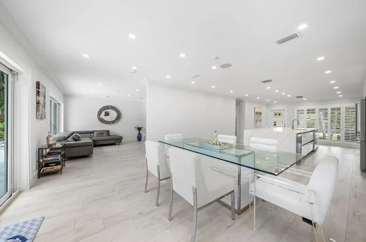 Dining with a view into the ktichen anfd living room