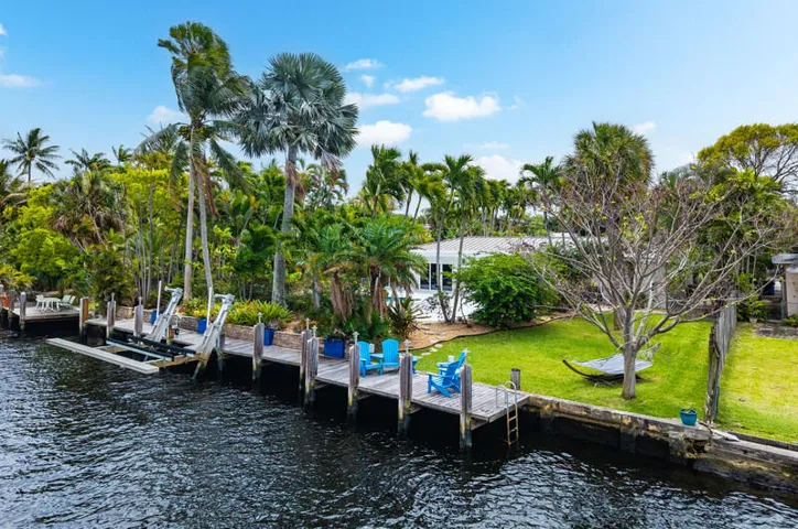 Enjoy the waterfront dock and boatlift and extra large yard