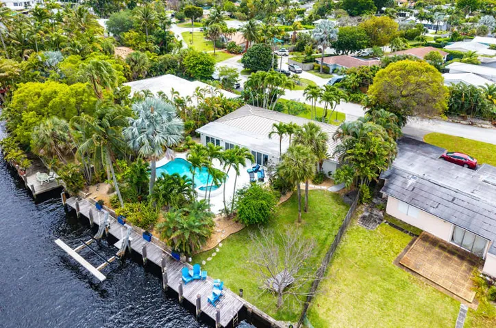 Aerial View of large lot with pool, outdoor entertainment area, dock and boat lift