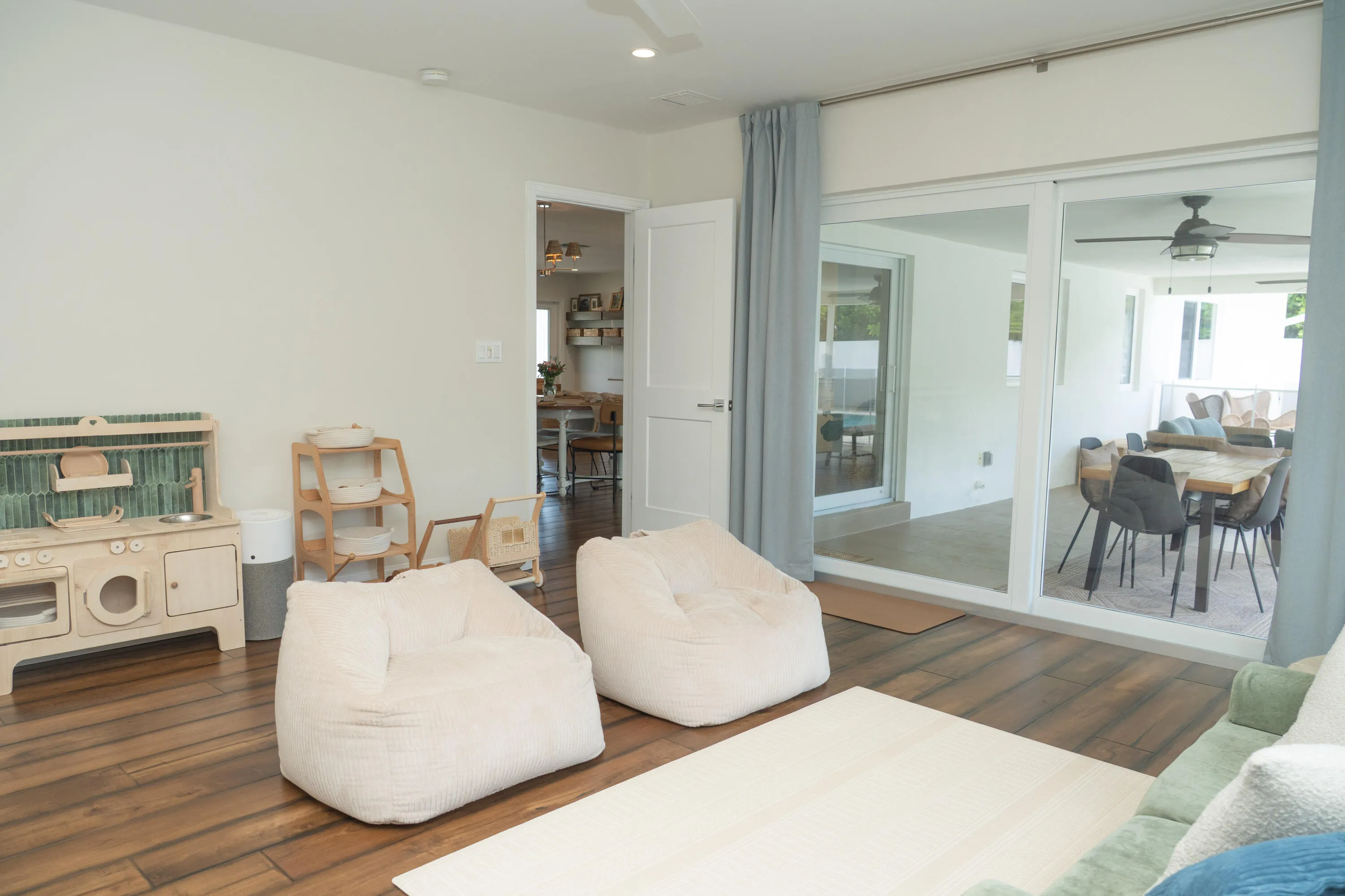 Bedroom 5 with Sliders out to the covered patio and pool