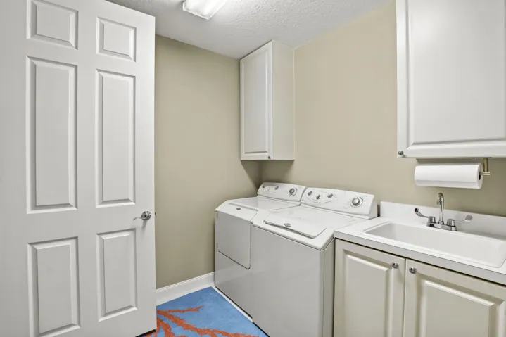 Laundry with sink and cabinet space