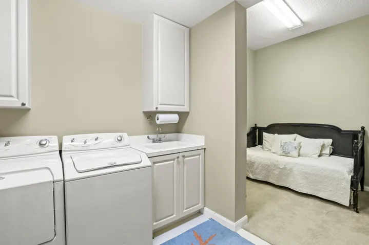 Laundry room with separate flex space great for home office, additional storage, or extra sleeping.