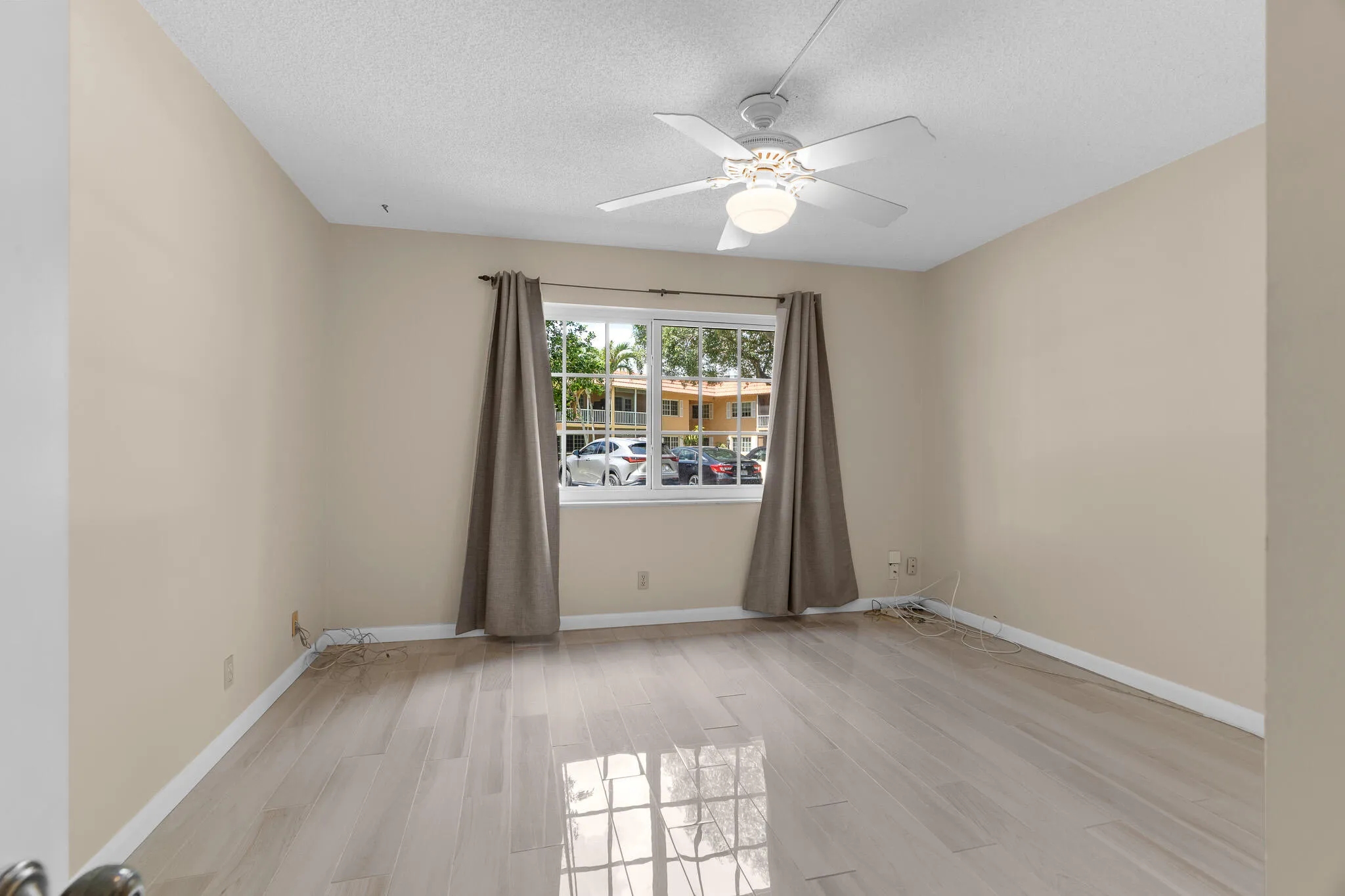 Spacious Guest Bedroom with Impact Windows and Porcelain Tiling