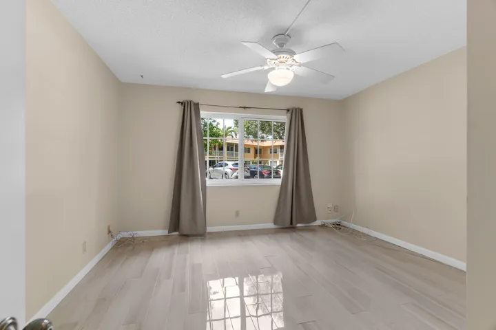 Spacious Guest Bedroom with Impact Windows and Porcelain Tiling