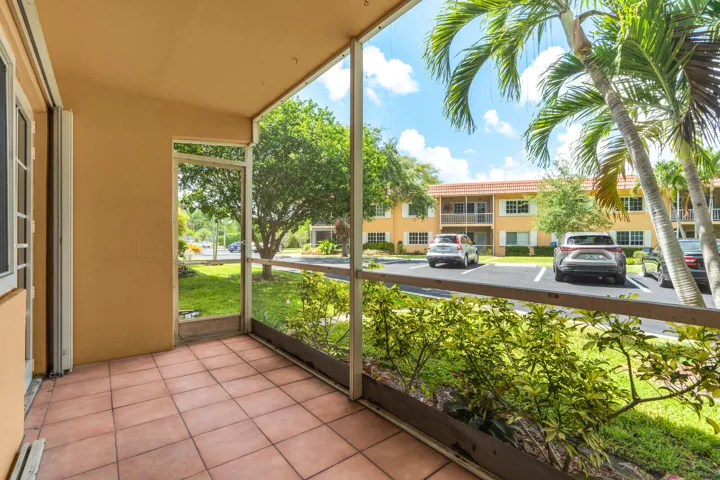Screened In Patio with Access to Parking Space directly across-very convenient!