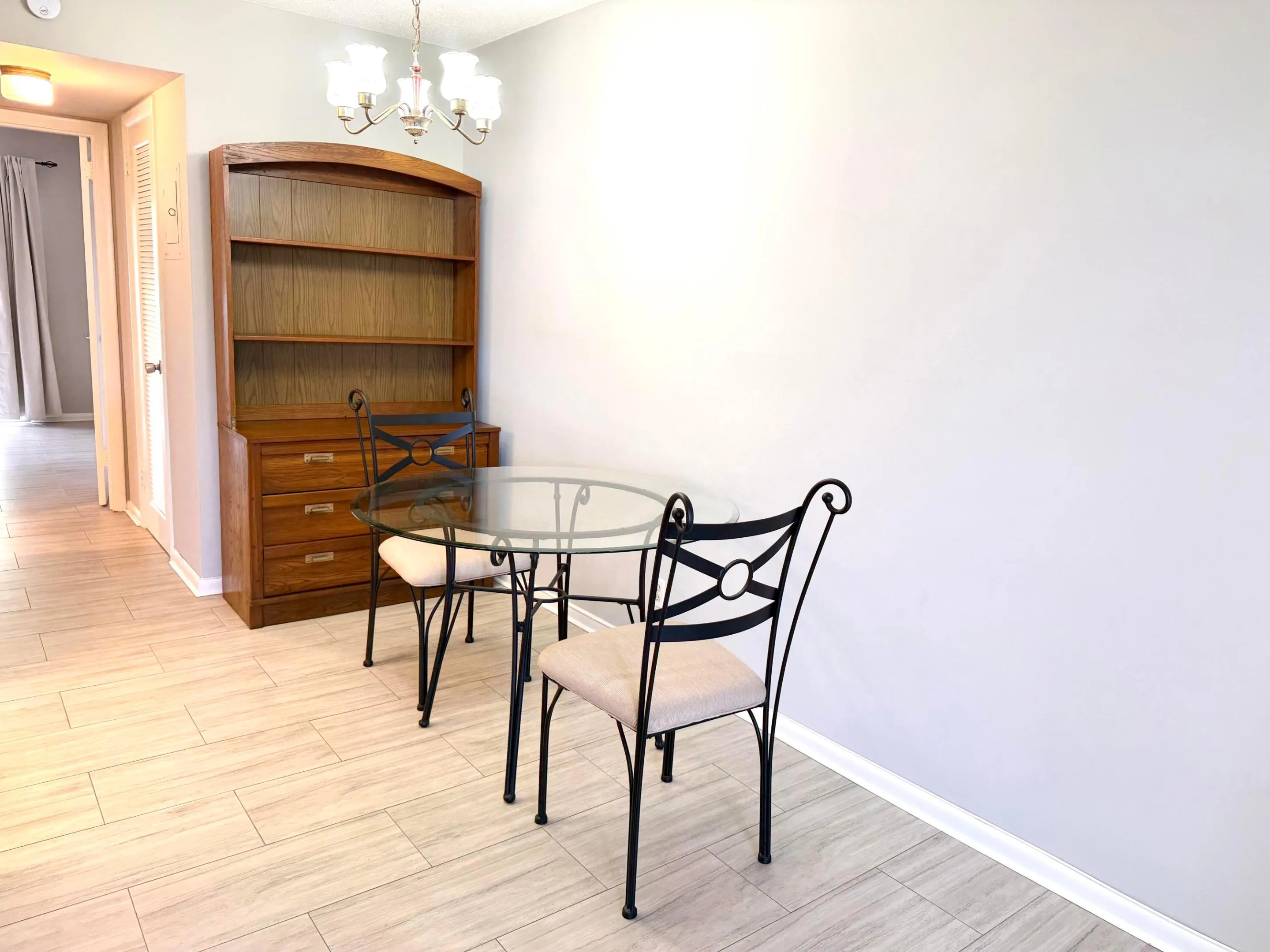 Dining room area with beautiful metal dining set with four chairs.