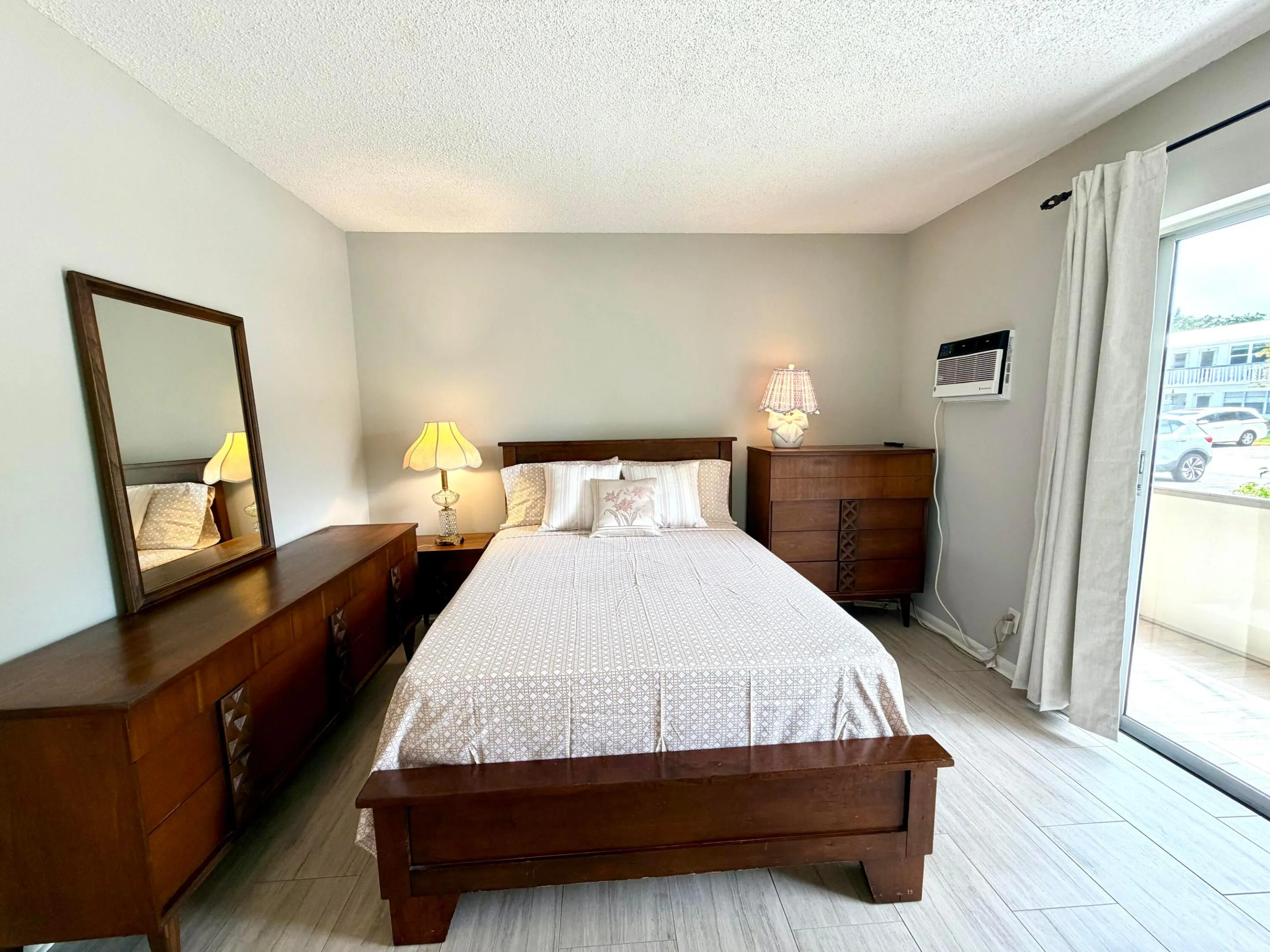 Spacious bedroom with Pottery Barn bed and brand new Tommy Bahamas sheet set.