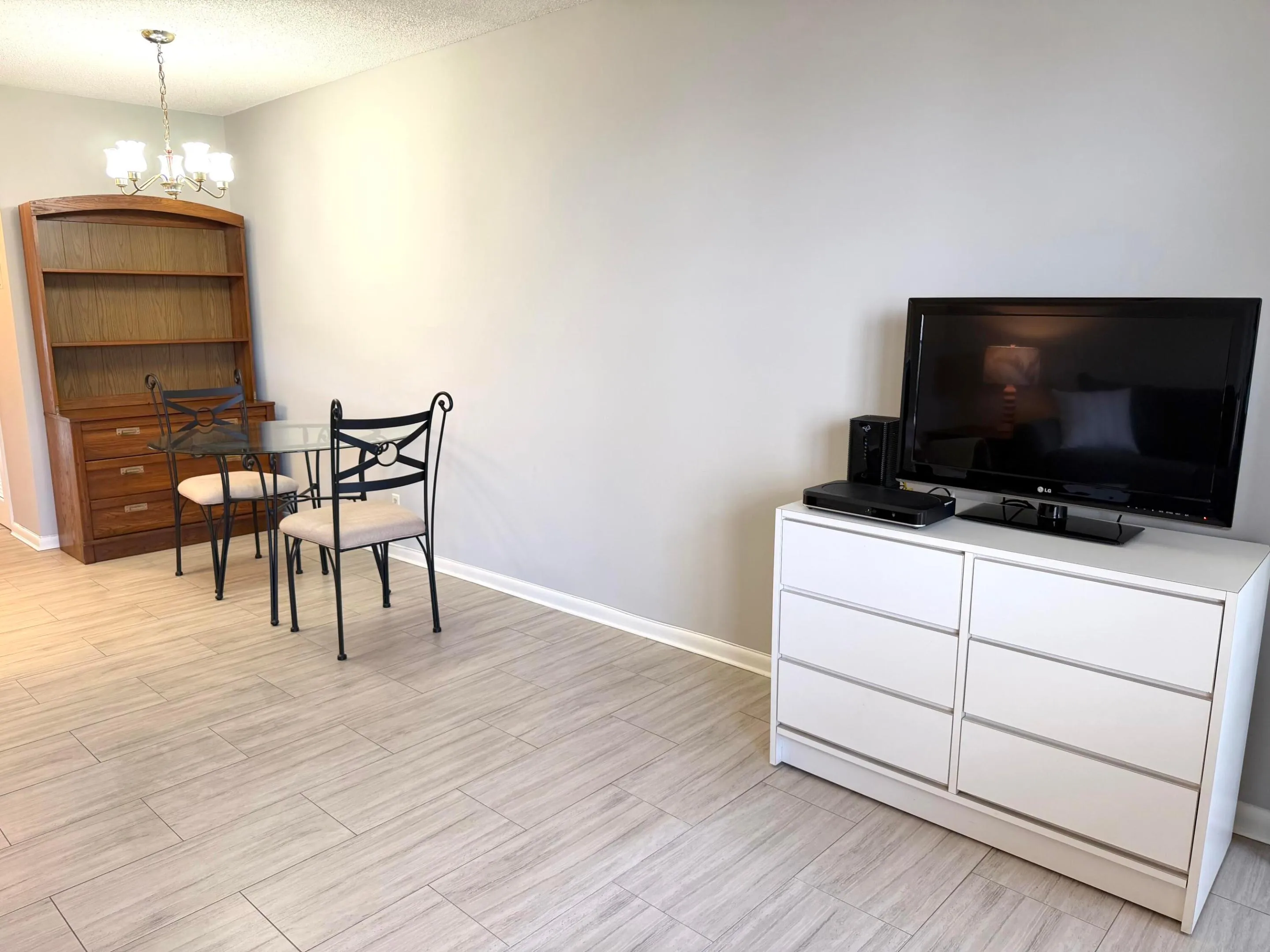 Living room area with big screen TV.