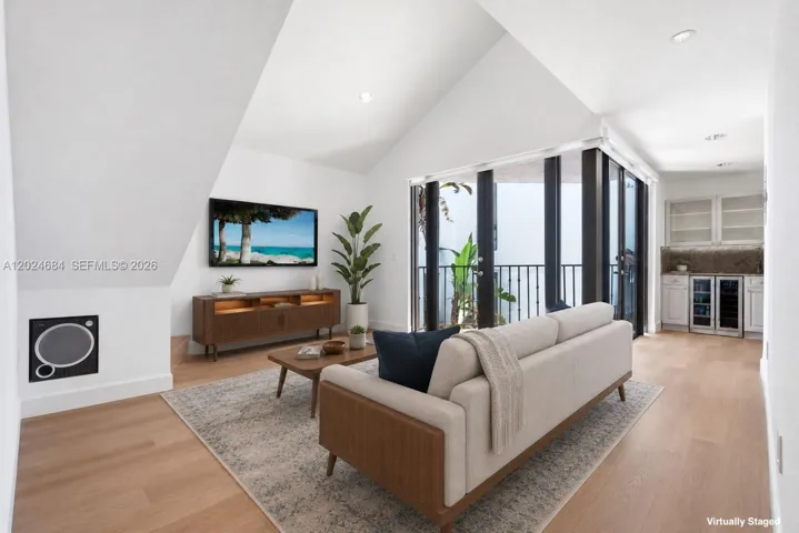 Welcome to this special unit with a Loft, 17 ft. vaulted ceilings and ample light. Motorized shades for the double doors in Living Area & Kitchen.