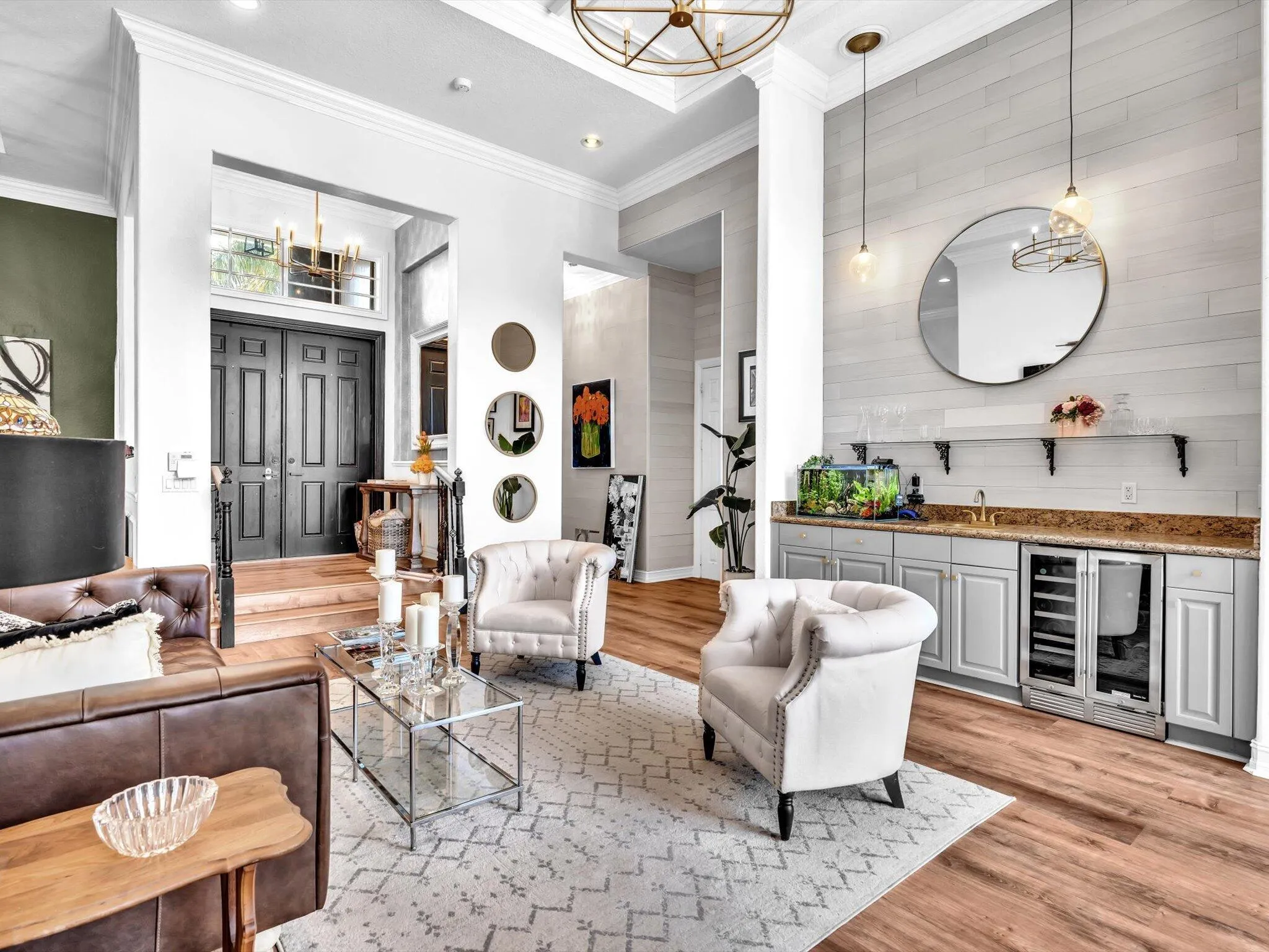 ANOTHER VIEW OF FORMAL LIVING ROOM WITH COFFERED CEILINGS, A WET BAR, WAINSCOTTING, WINE FRIDGE, SPECIALTY WINE DISPLAY AND SLIDING DOORS TO OUTSIDE AREA