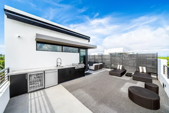 Rooftop deck with summer kitchen and awnings