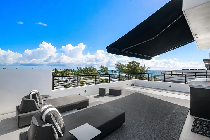 Retractable awnings on the rooftop deck