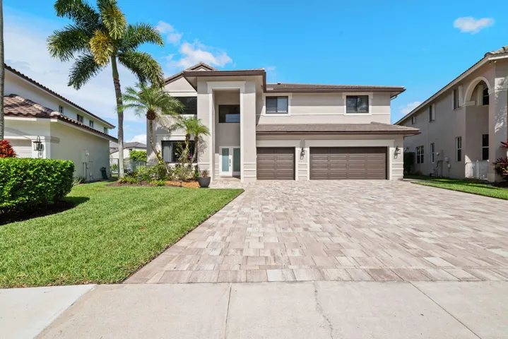 6-car paver driveway and 3-Car Garage home on culdesac street