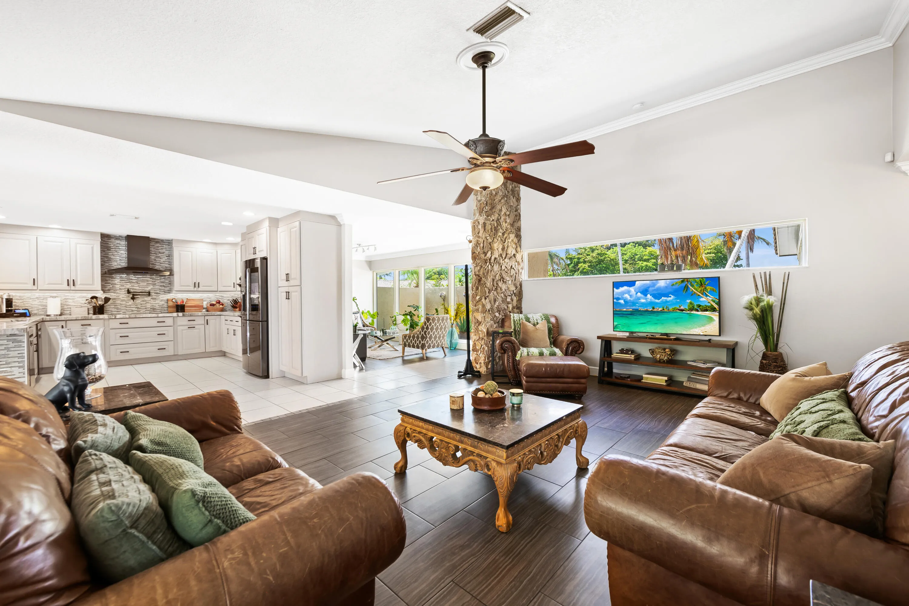 Living Room with view of Florida room and kitchen
