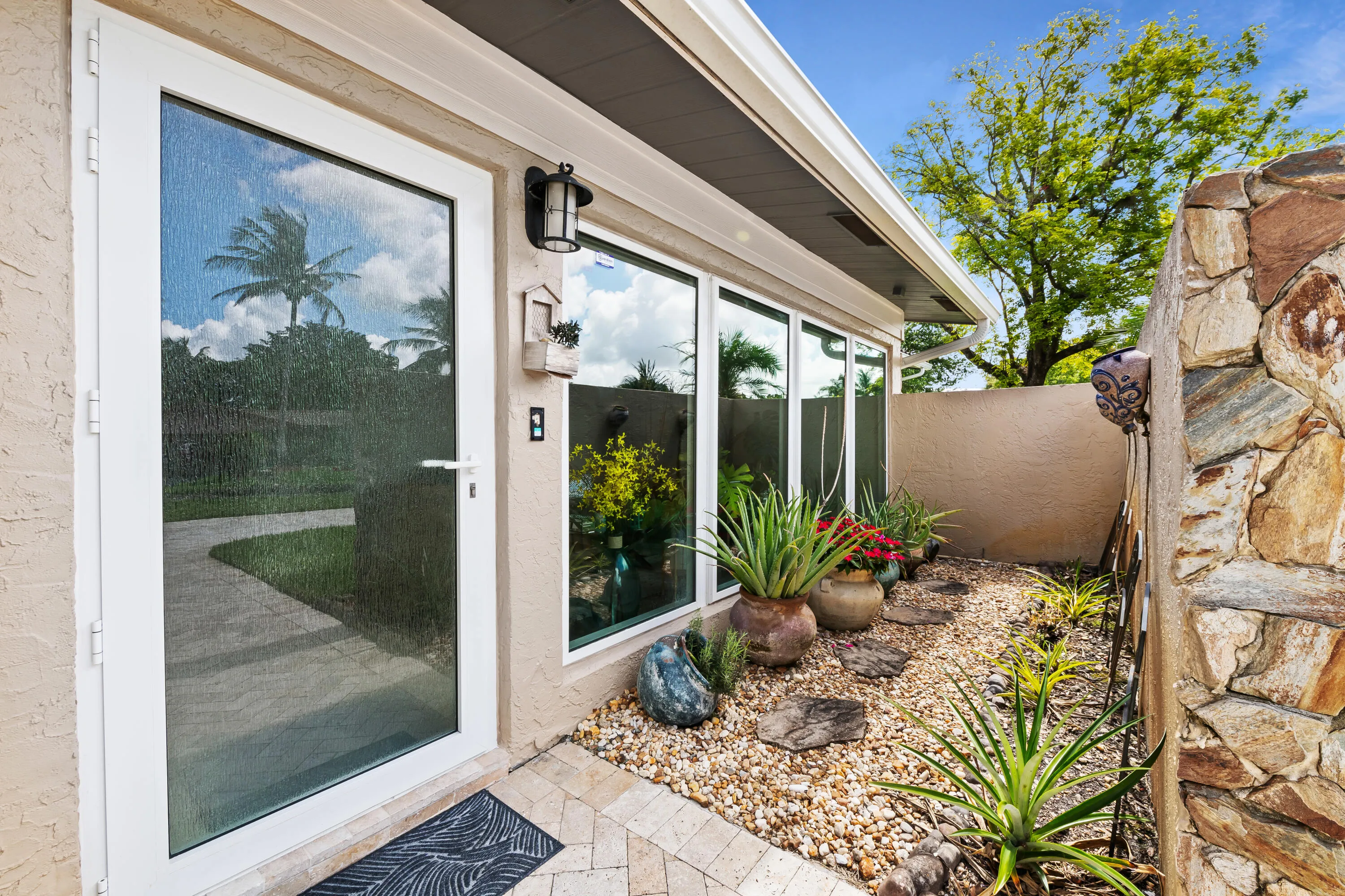 Manicured low maintenance landscaped entrance