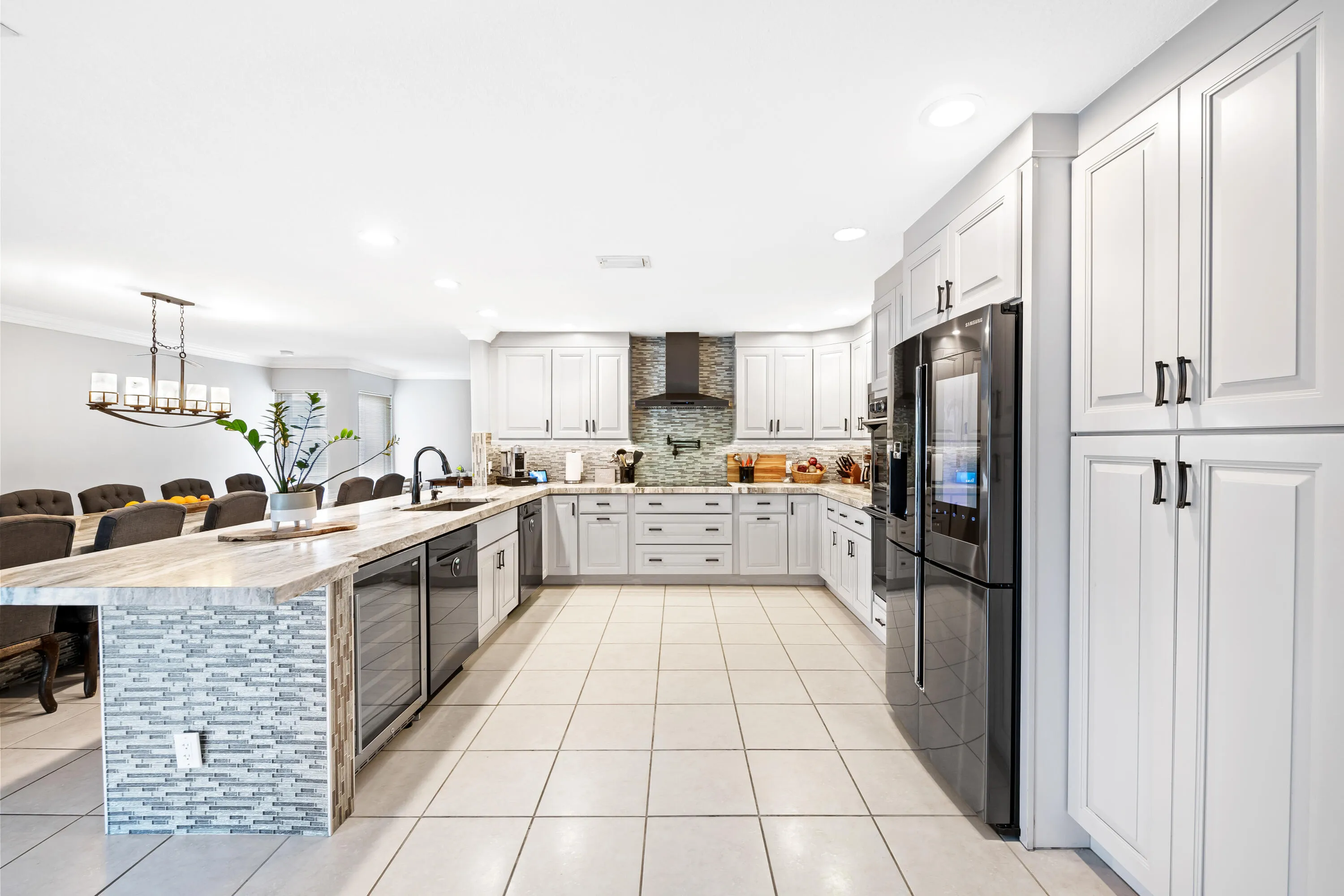 Kitchen with two dishwashers, pot filler, double oven, cook top, smart fridge and wine fridge