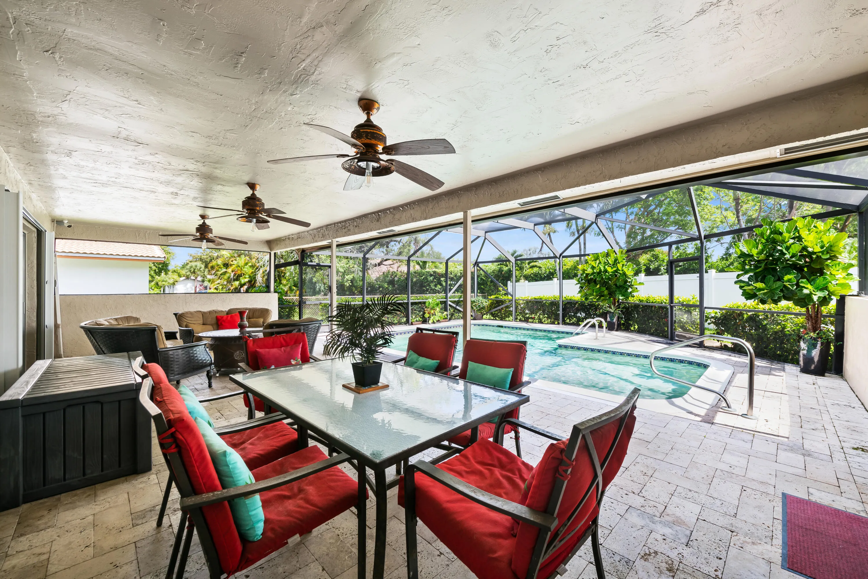 Screened back patio with pavers and saltwater pool