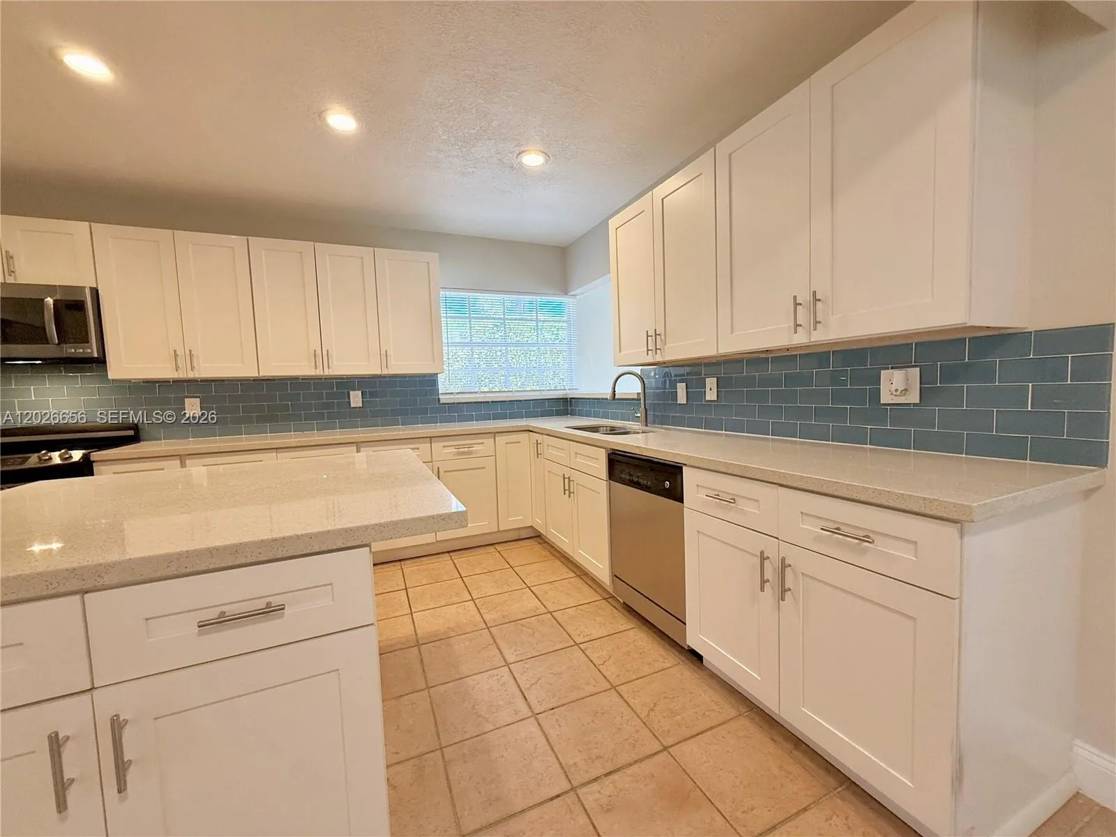 Spacious laundry room with new washer and dryer