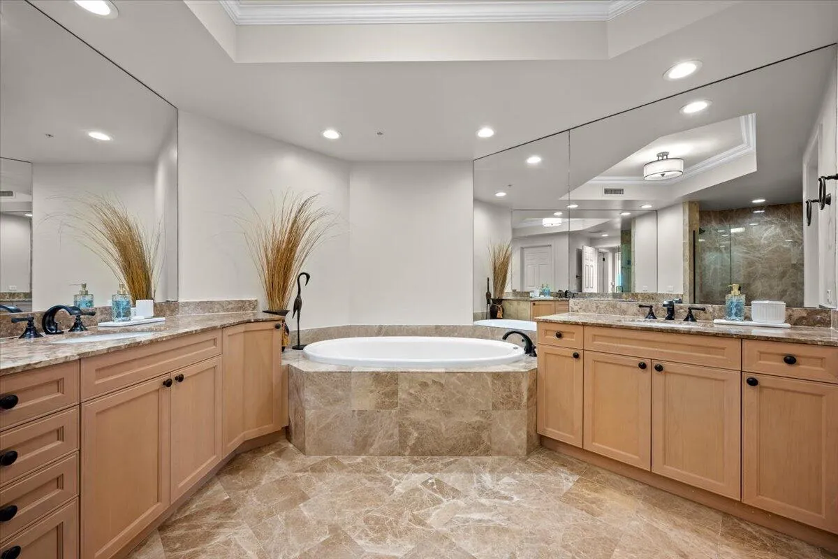 Spa-like primary bathroom with separate shower and tub