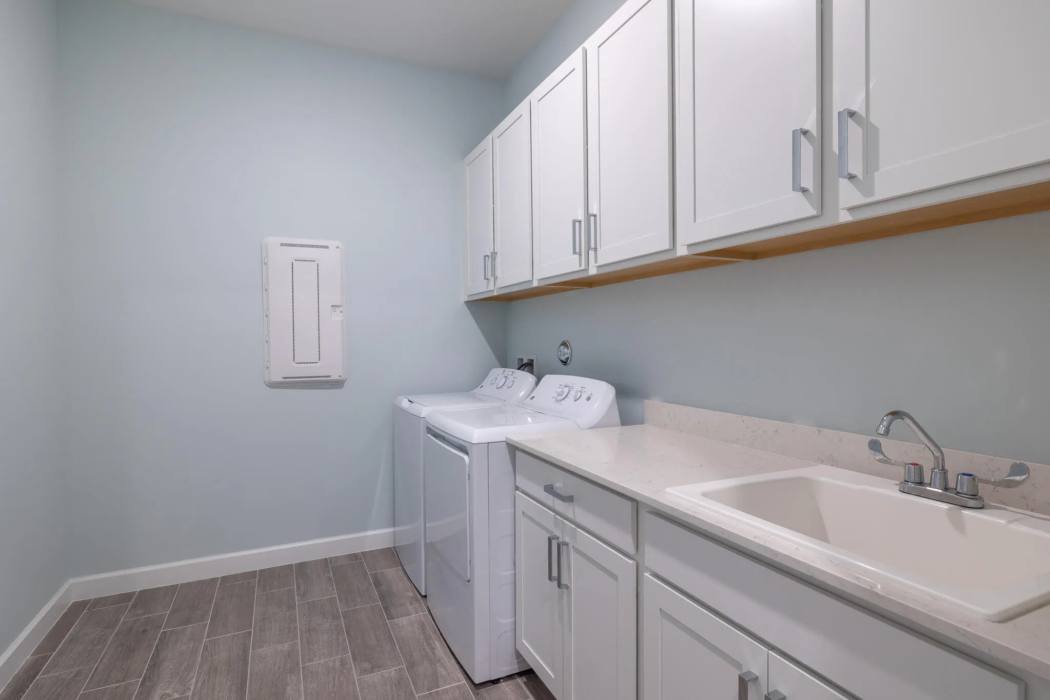 SPACIOUS LAUNDRY ROOM WITH MUD SINK, LOTS OF STORAGE.