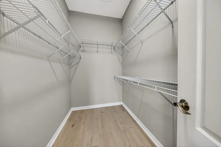 Walk in closet in primary bedroom