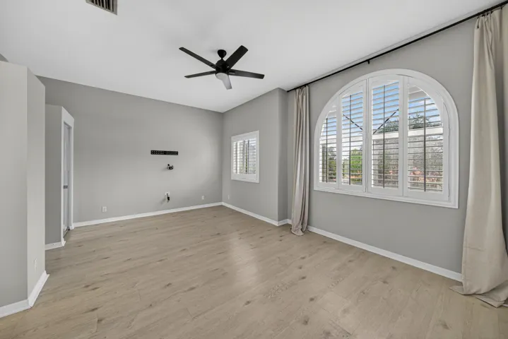 Plantation shutters in primary bedroom