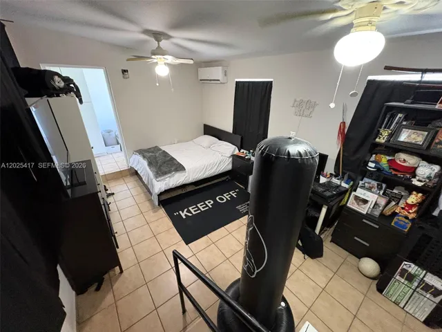 Den currently being used as an extra bedroom.