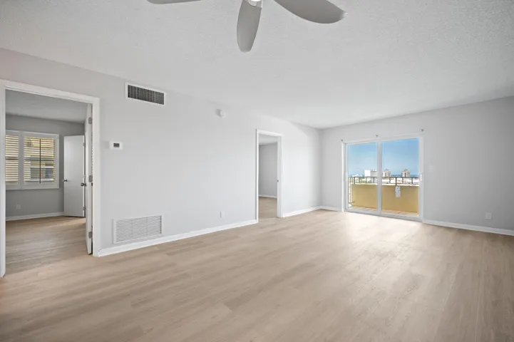 Unit 1407 living area and the two bedroom doors and balcony.