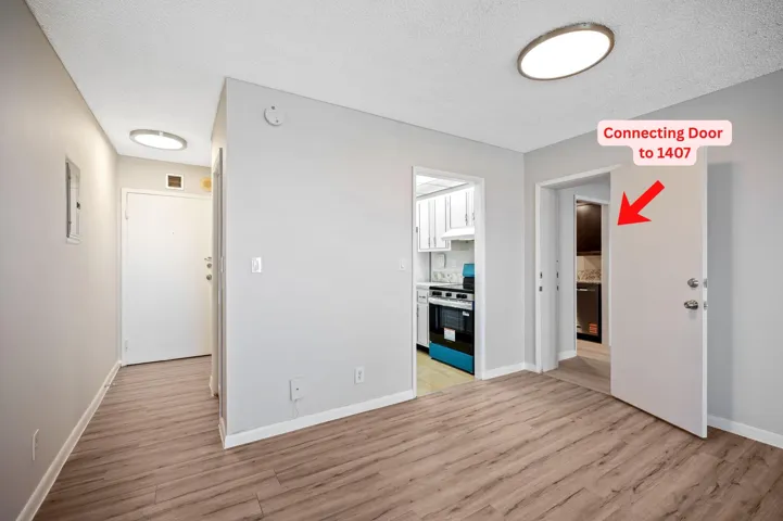 Unit 1407 entry door, entry to kitchen and 2nd adjoining door to 1406.