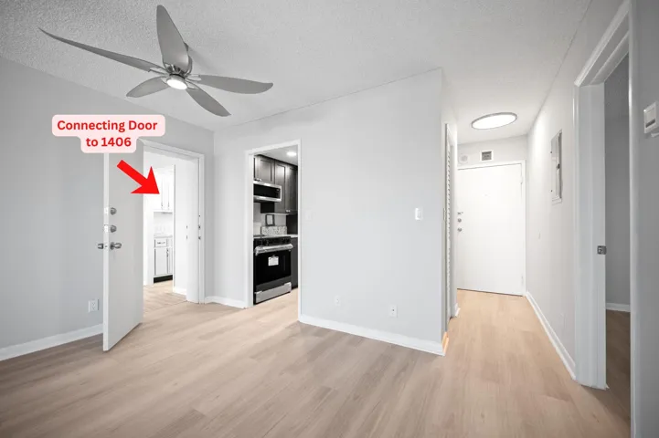 Unit 1407 adjoining door, kitchen and main entry.
