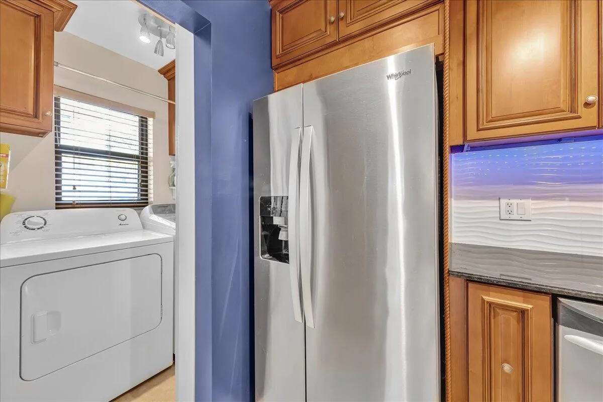 Laundry Room with sliding frosted atrium door off kitchen